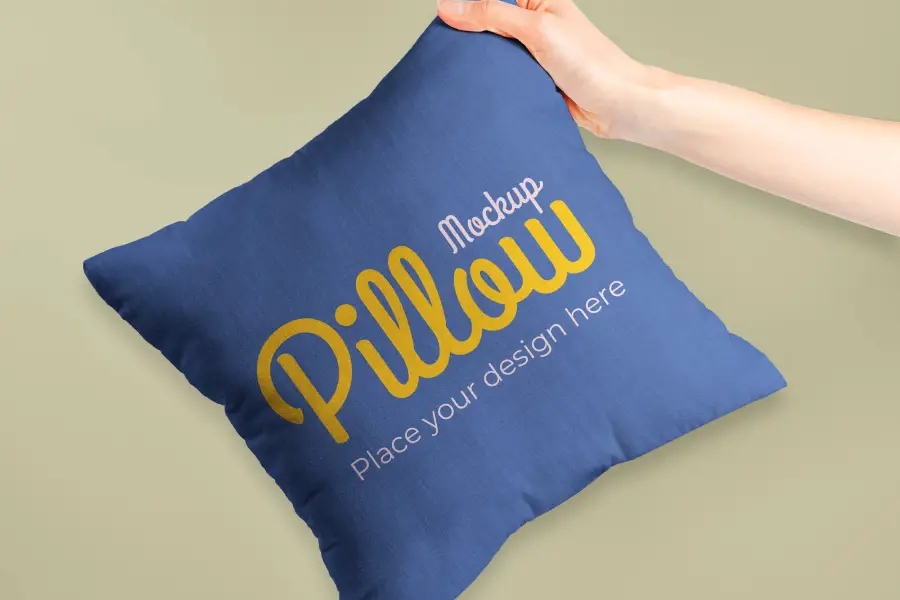 Hand Holding Pillow Mockup - 